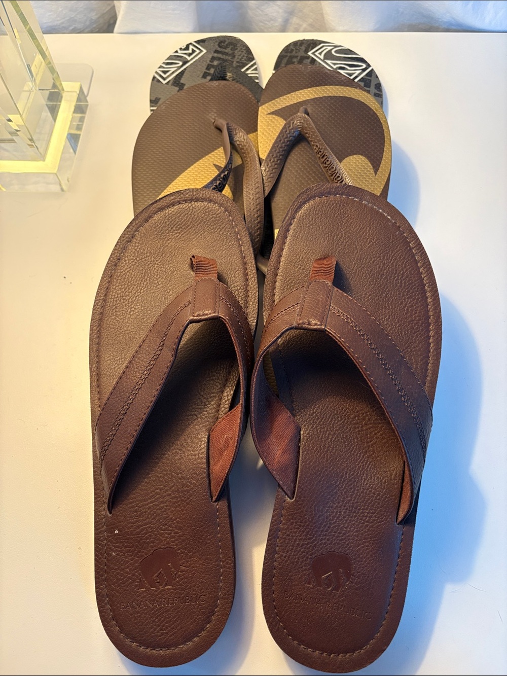THREE pairs of men’s flip flops